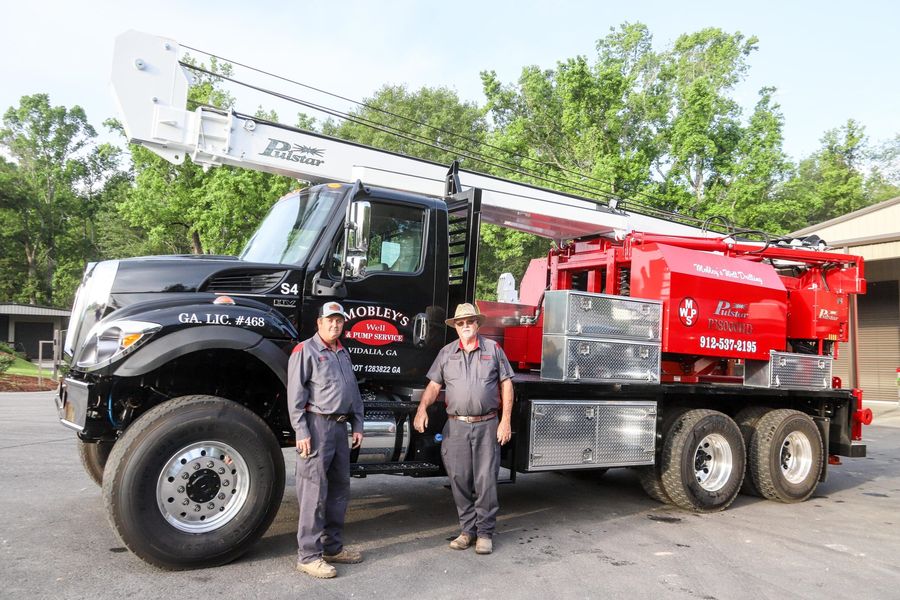 Mobley's crew beside a drill truck