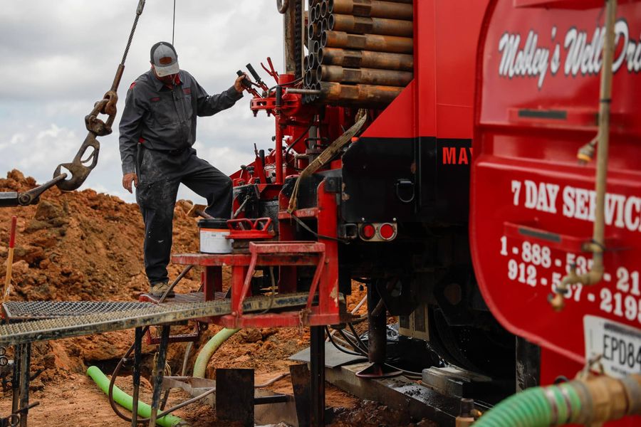 Mobley crew member working the drill rig