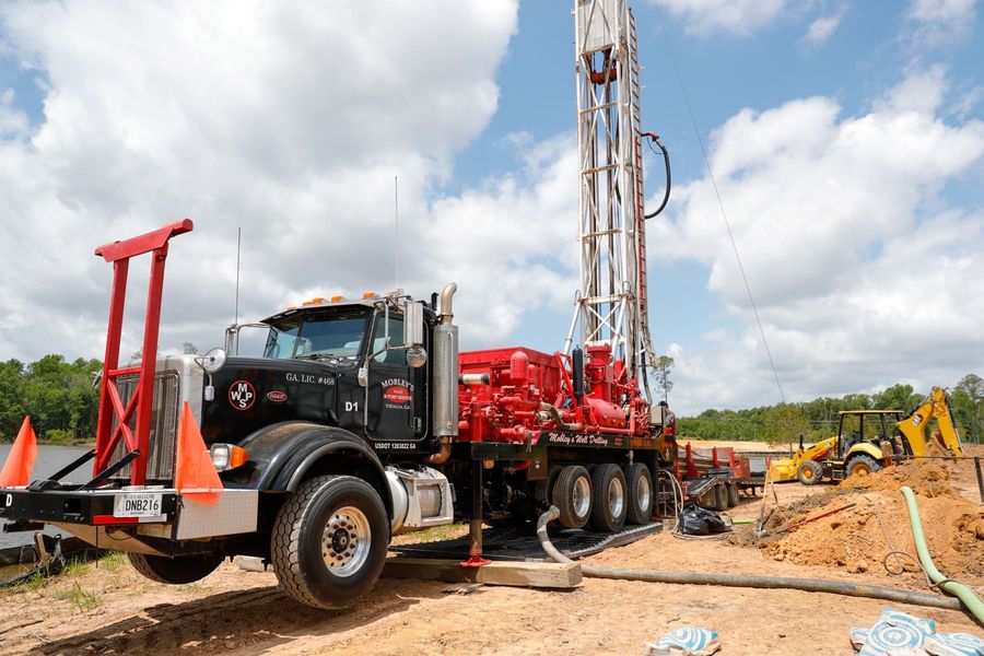 Mobley drill rig truck on a job site