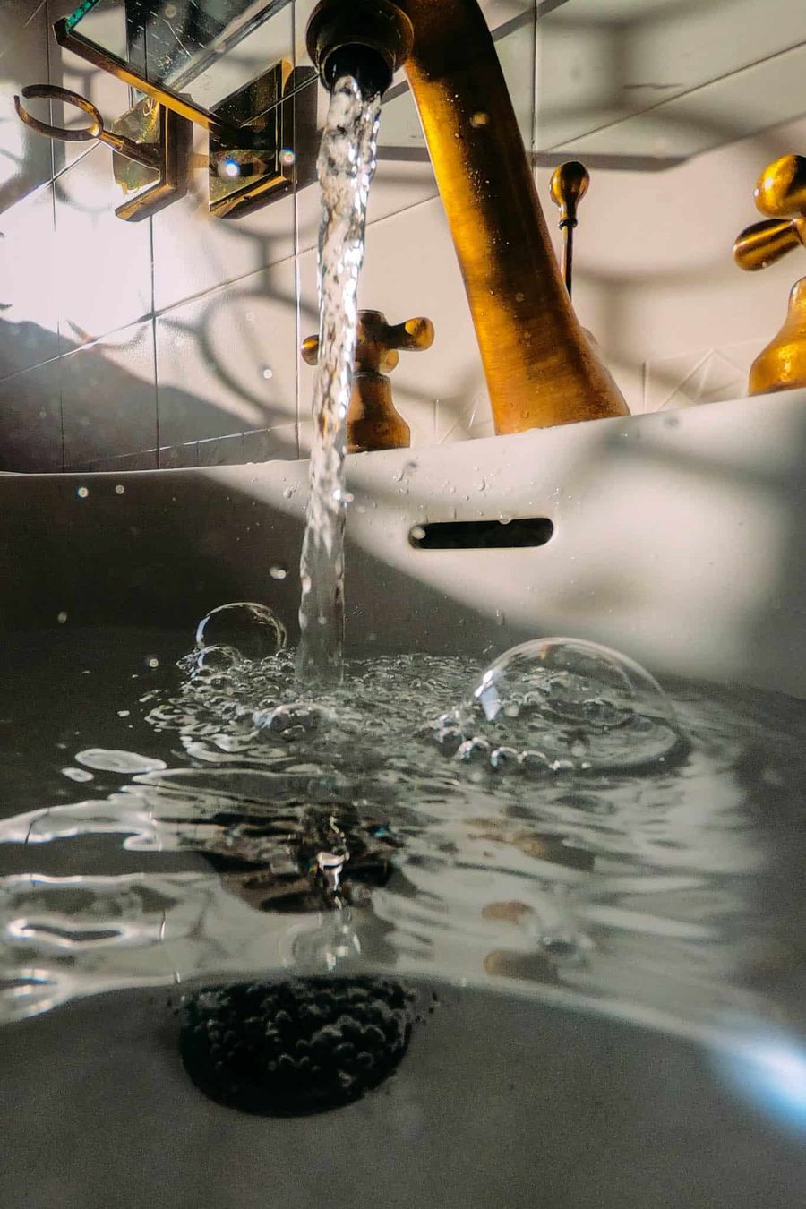 Clear water filling a sink